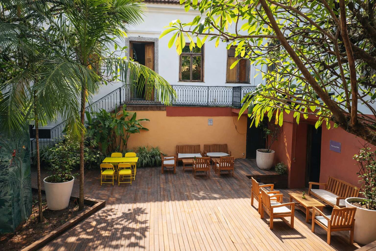 The shared Casa courtyard and its greenery by day